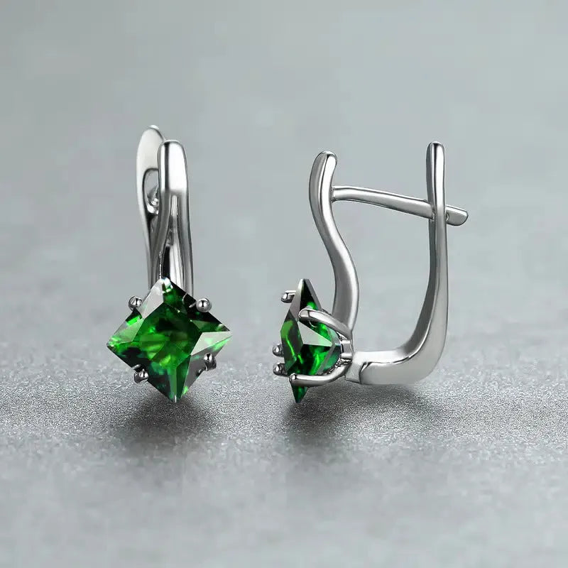 Women's copper diamond design earrings with inlaid zircon detail in blue, green, and colour variations.