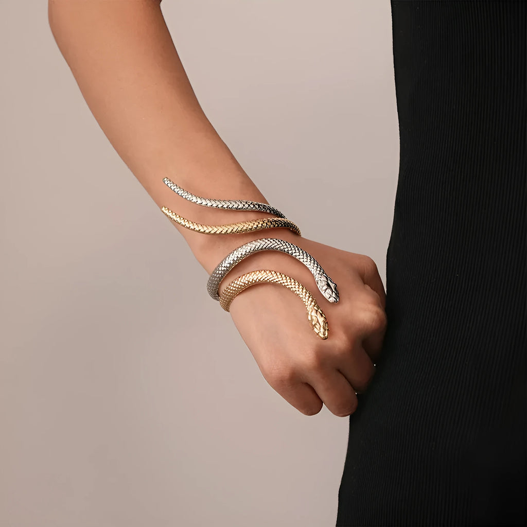 Gold and silver snake-inspired ring and bracelet set with twisted winding design