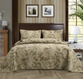 Blue American-style floral and bird quilted cotton bedspread set on a bed, showing its 230x250 cm size.