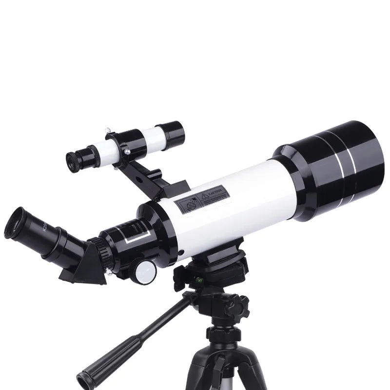 Dark blue children's monocular astronomical telescope with tripod on a table.