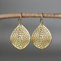 Gold-coloured retro drop earrings with a creative hollow leaf pendant design.