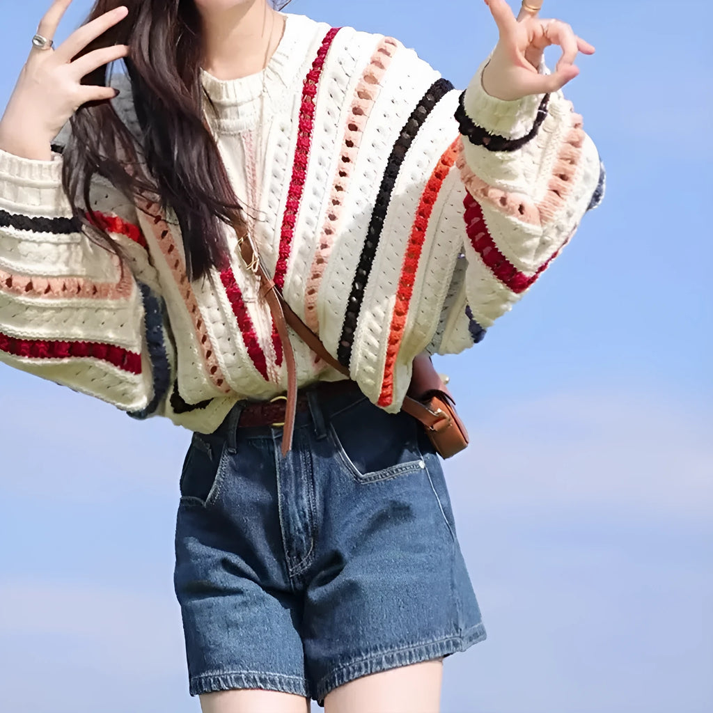 Rainbow striped hollow sweater with batwing sleeves and round neck in poly-cashmere blend
