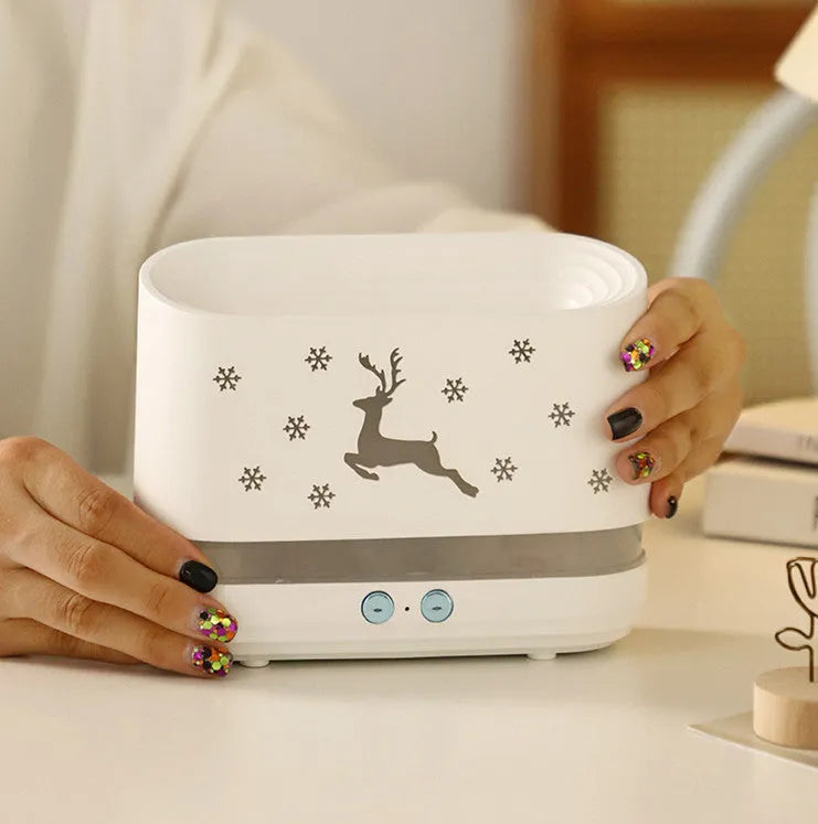 White flame effect humidifier diffuser with LED lighting and Christmas pattern, showing mist output