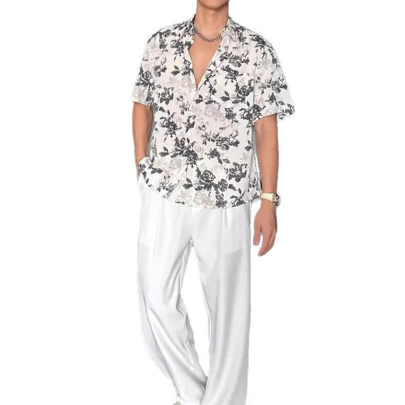 Women's loose casual short-sleeve shirt with a floral print pattern in white or black.