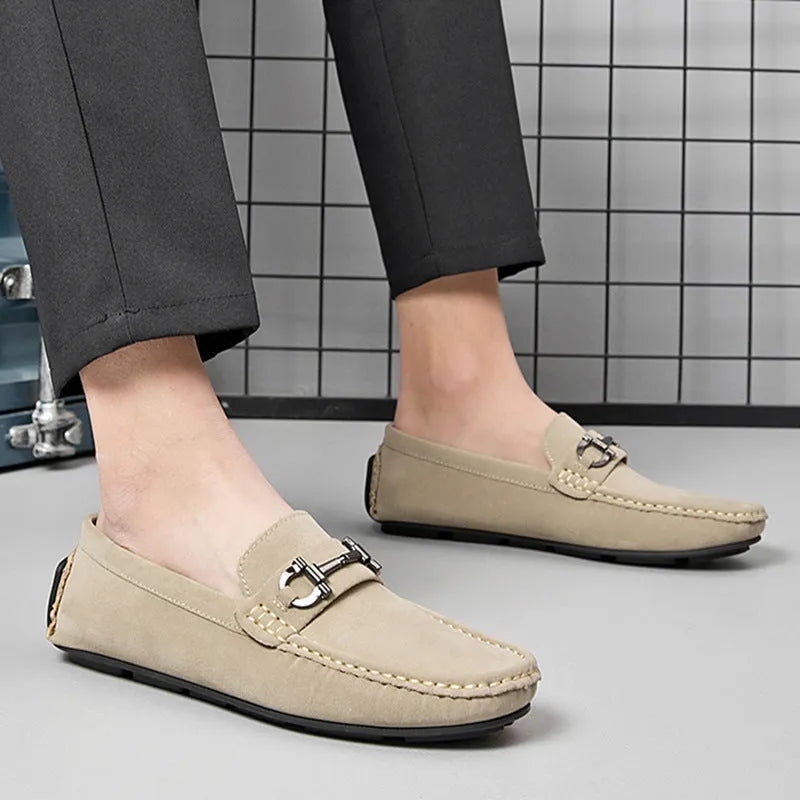 Men's brown leather slip-on loafers with a round toe and rubber sole.