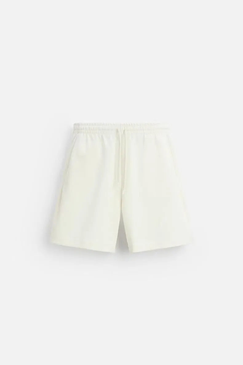 Loose double-sided cloth texture short sleeve shirt and matching shorts in blue, laid flat.