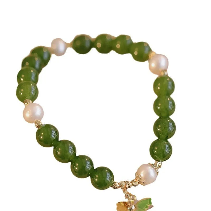 Women's natural green chalcedony bracelet with round geometric beads and handmade craft details