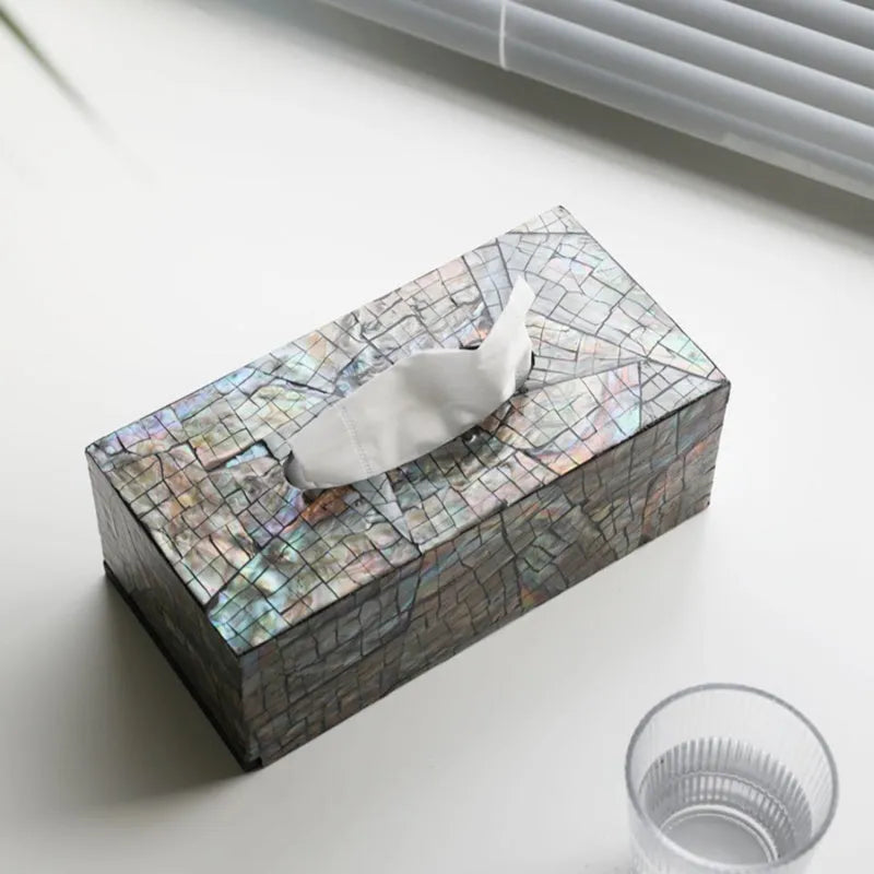 Natural shell decorative storage box tissue holder in square and rectangular shapes on a table.