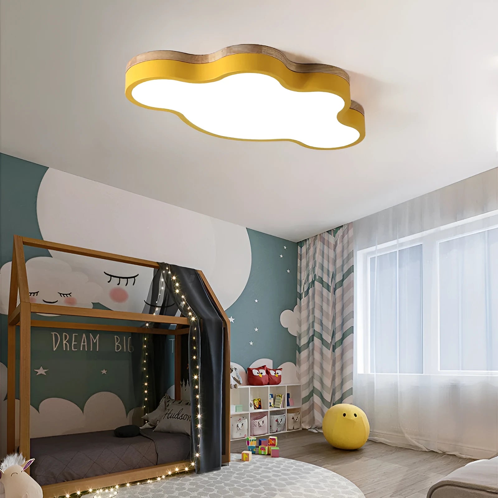 Modern cloud-shaped LED ceiling light in a wooden finish, shown in pink, mounted on a ceiling.