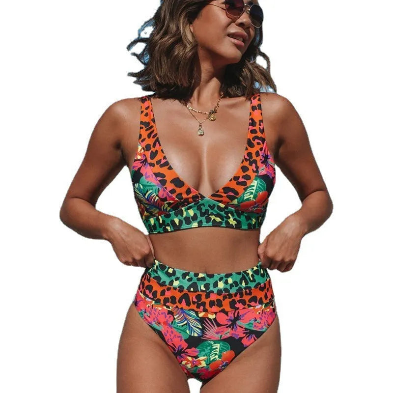 Women's high-waisted floral print bikini set for swimming on mannequin.