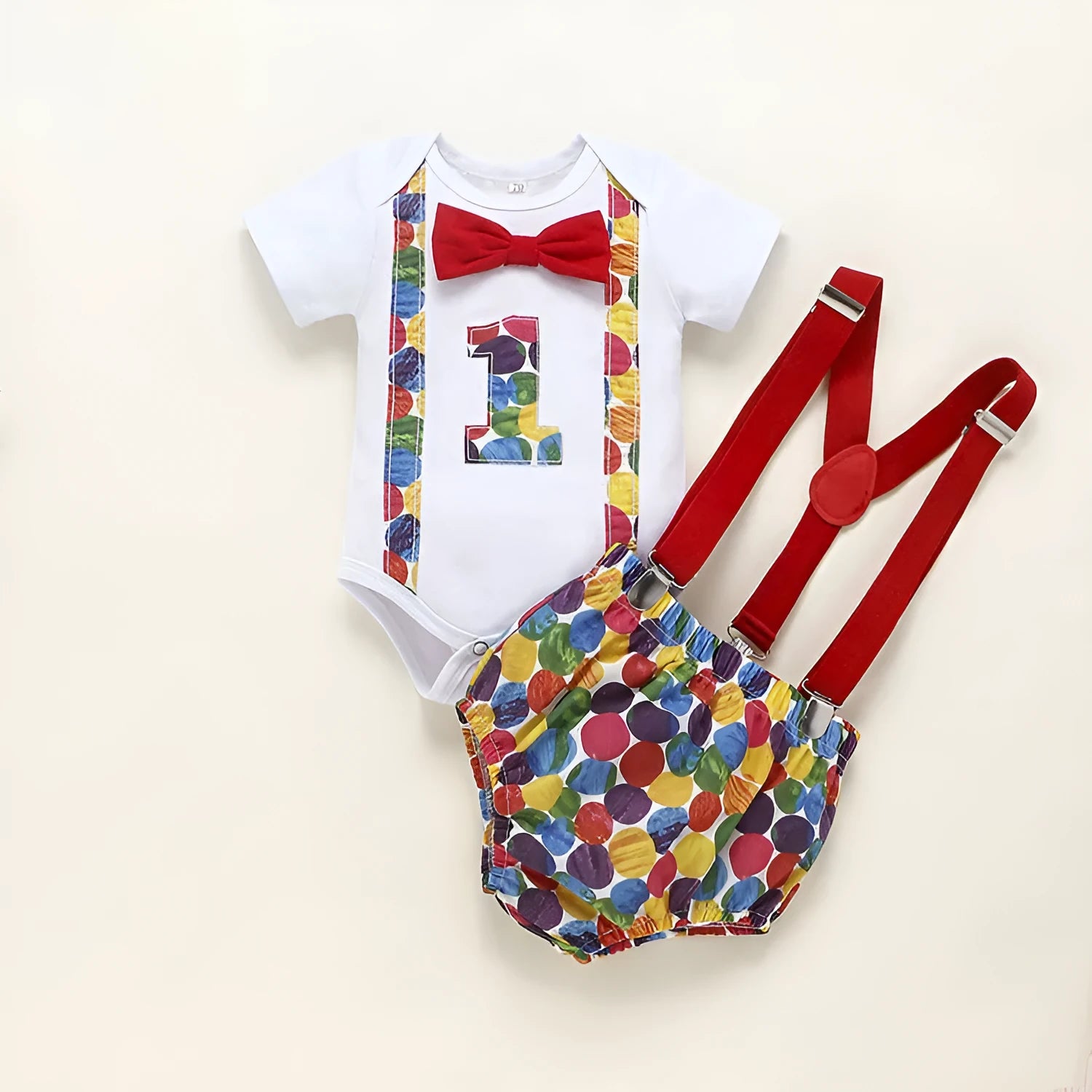 Baby in a soft cotton dinosaur print romper with shorts, showing the pullover design and clean finish.