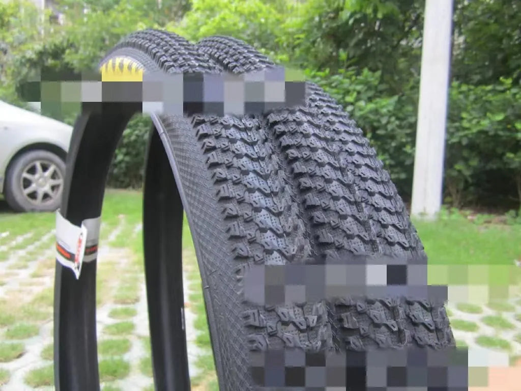 Ultralight puncture-proof mountain bike tyre showing tread pattern and sidewall in available sizes
