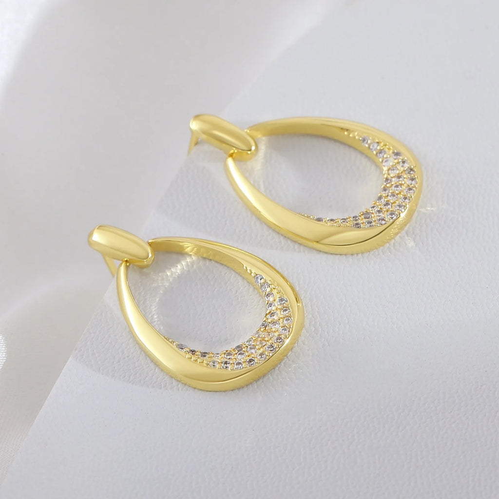 Women's yellow gold geometric drop earrings with 2.6cm length and round ring design elements