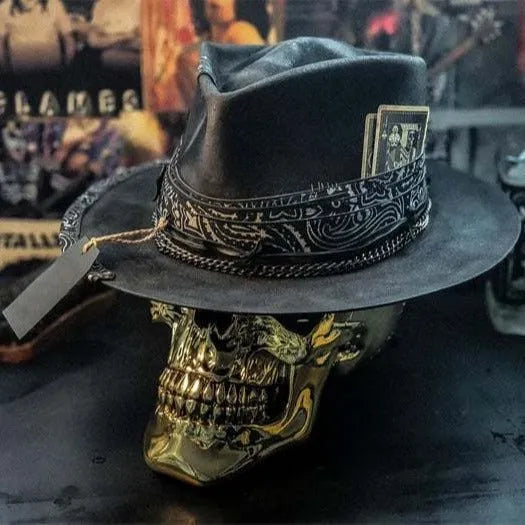 Handmade conical skull hat crafted from wool felt and denim fabric in a dark colour.