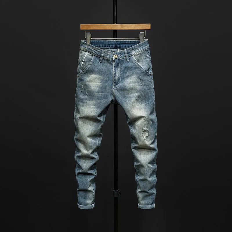 Men's slim-fitting skinny jeans in dark blue denim with a mid-waist design.
