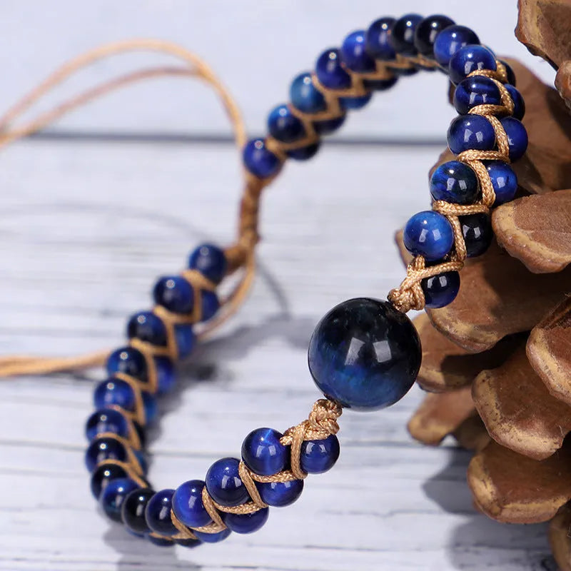 Handwoven geometric pull bracelet with blue tigereye stone beads on elastic band