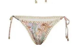 Women's floral print bikini set with top, briefs, and removable skirt in creamy-white colour