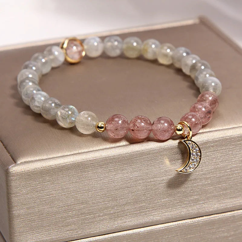 Women's multi-layer crystal bracelet with natural garnet, strawberry quartz pendants, and jinsi jade beads in assorted colours.