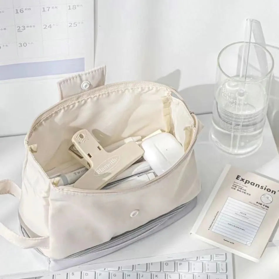 Polyester folding double-layer pencil case in dark blue, blue, or cream white.