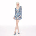 Women's blooming blue long-sleeved swim blouse with steel support and matching briefs on a hanger.