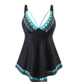 Plus size green two-piece bikini swimsuit with backless design on a mannequin.