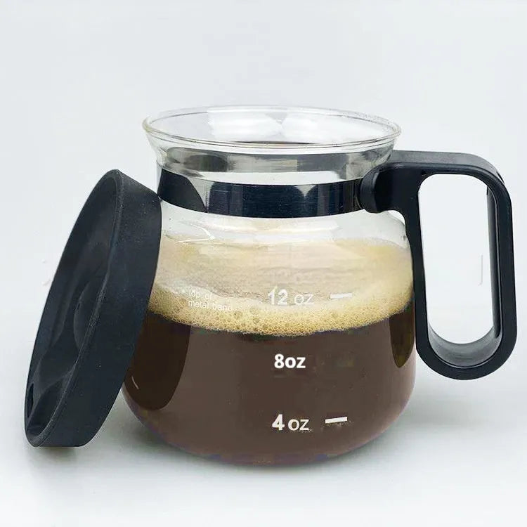 Transparent borosilicate glass coffee maker with silicone cover showing modern simplicity design