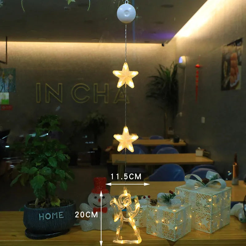 Set of three battery-powered LED Christmas pendant lights with suction cups, showing star, tree, and deer designs.