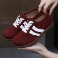 Women's vintage canvas sneakers in dark red, maroon, and khaki with round toe and flat rubber sole.