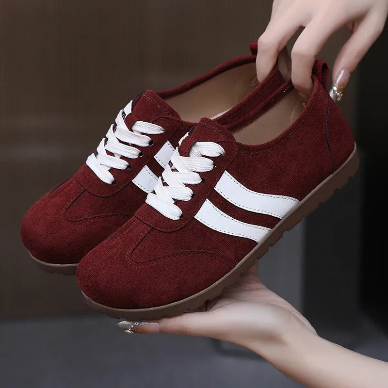 Women's vintage canvas sneakers in dark red, maroon, and khaki with round toe and flat rubber sole.