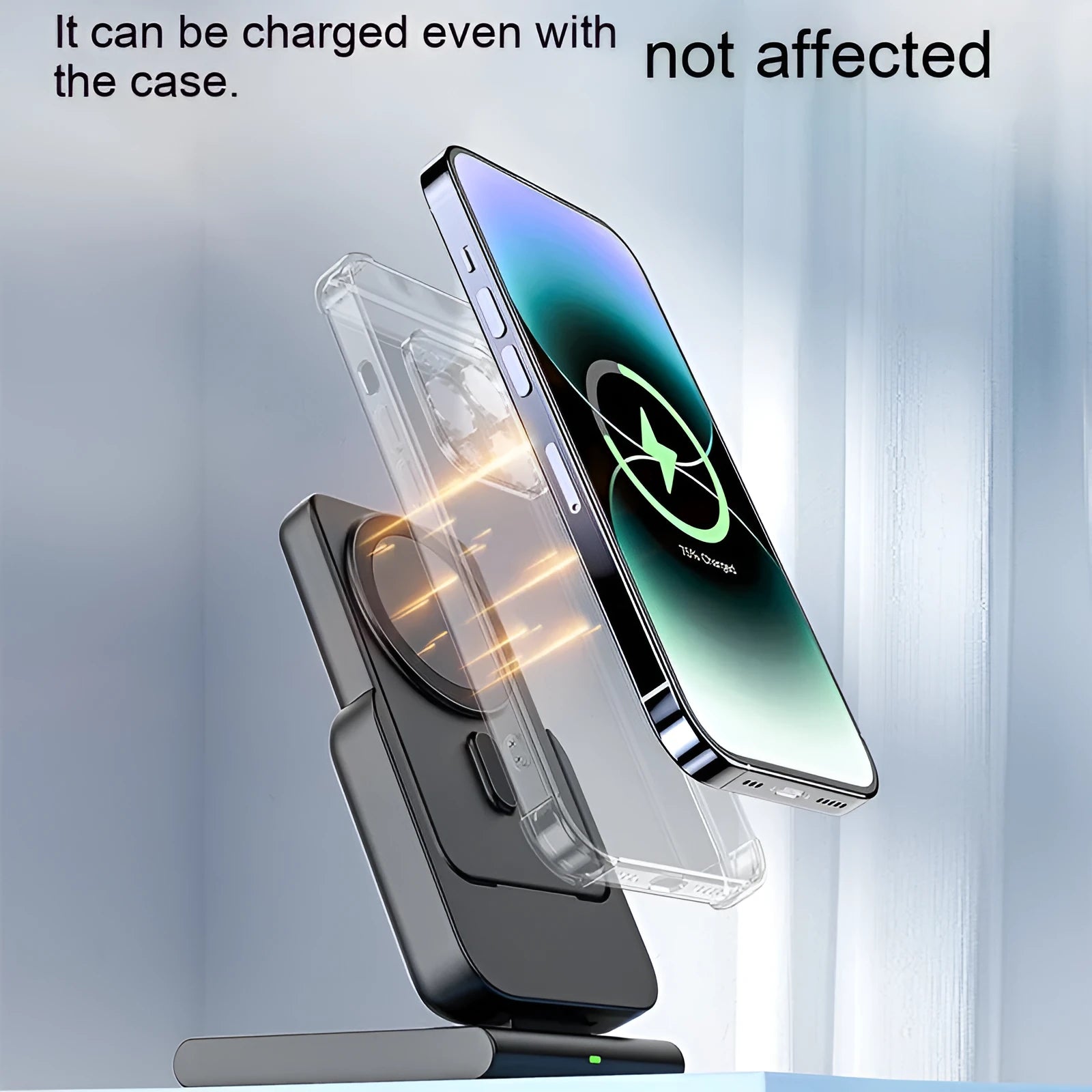 Black three-in-one magnetic power bank with folding stand charging iPhone 12, Apple Watch, and AirPods Pro wirelessly on a desk