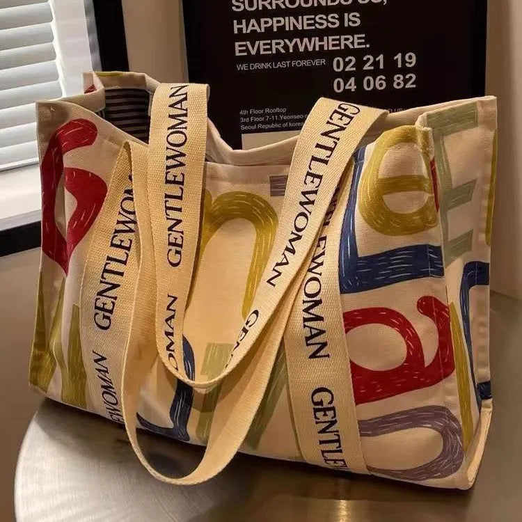 Large canvas tote bag with printed design options for travel and shopping