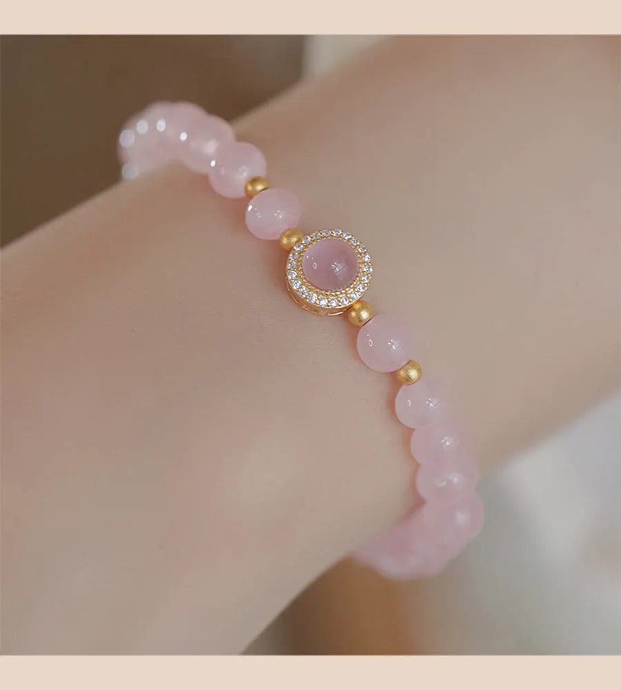 Ladies copper bracelet with Taoji pink crystal beads in natural style on display