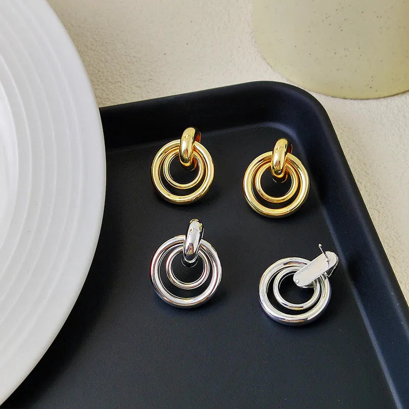 Geometric round ring drop earrings in gold or silver colour with irregular shape
