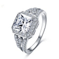 Geometric hollow zircon ring for women in platinum colour on copper, showing quadrilateral design and inlaid stones.