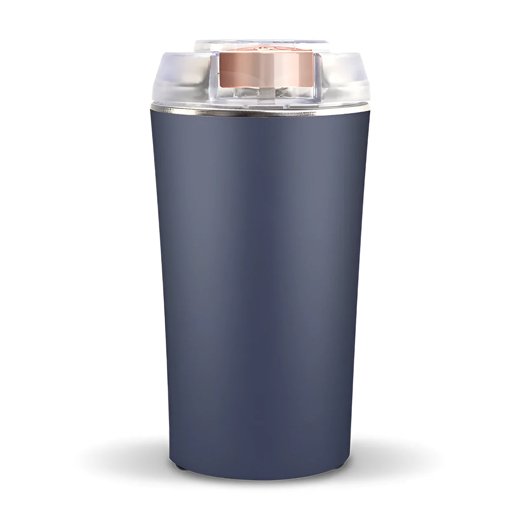 Blue mini food grinder and flour mill with stainless steel construction on a kitchen countertop.