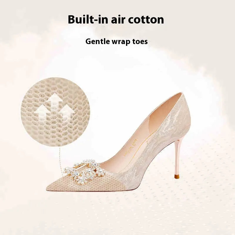 Champagne gold pointed toe stiletto heels with rhinestone details on matte leather