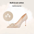 Champagne gold pointed toe stiletto heels with rhinestone details on matte leather
