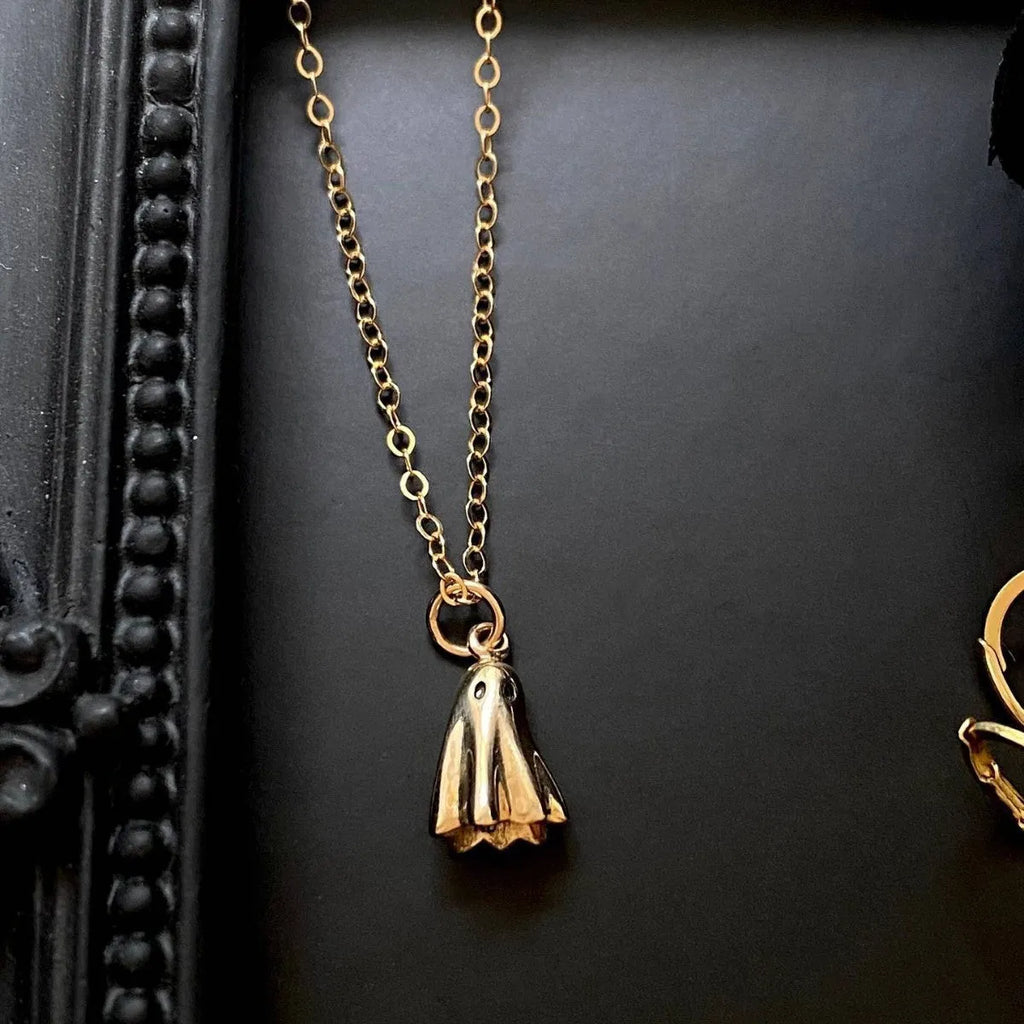Ghost pendant necklace with titanium steel pendant on a stainless steel chain, showing chain style options.