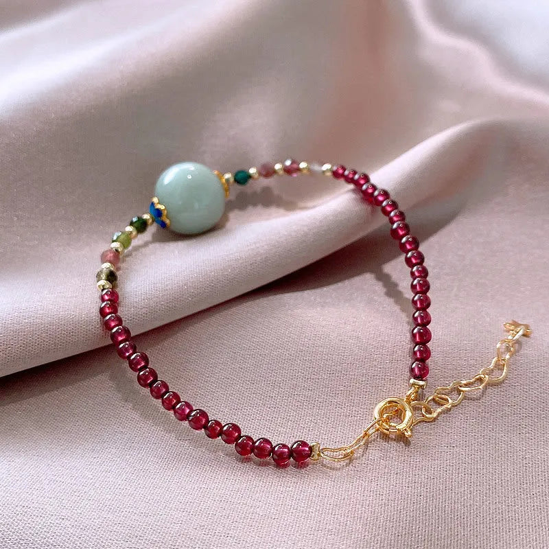 Aquamarine Chinese style garnet coloured tourmaline bracelet with a drop shape.