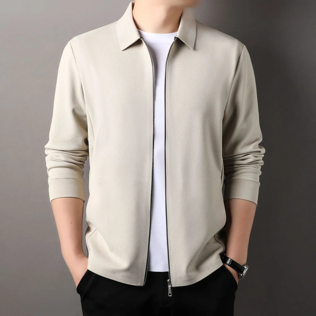 Men's black polyester jacket with long sleeves and a straight hem on a hanger.