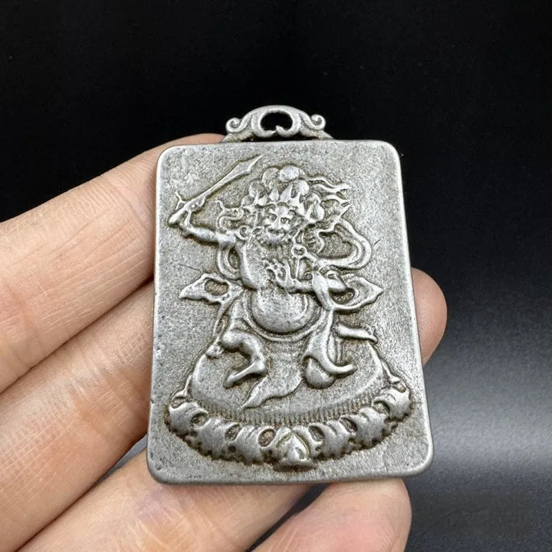 Close-up of iron hanging ornament pendant depicting Aryaacalanatha, Yamantaka in Chinese style.