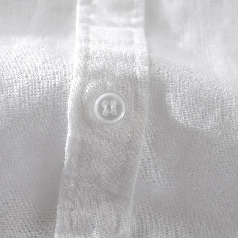 Men's solid colour short sleeve linen blend shirt on a hanger, showing loose fit.