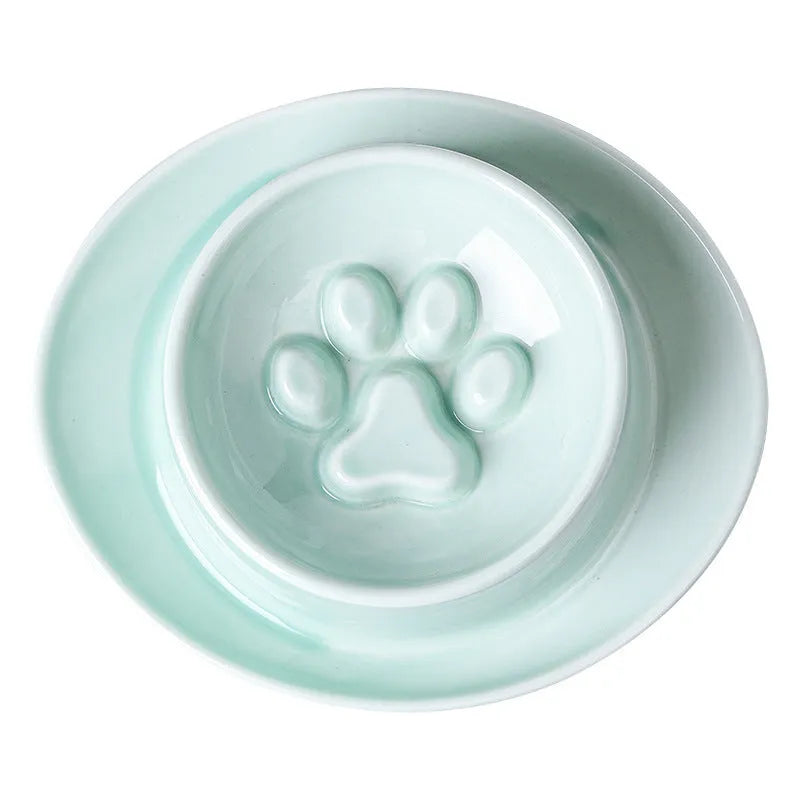 Green ceramic slow feed pet bowl with a central mound and obstacles to prevent fast eating.
