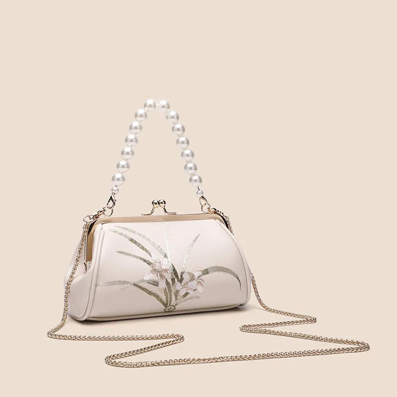 Beige women's shoulder bag with floral embroidery on soft PU leather material