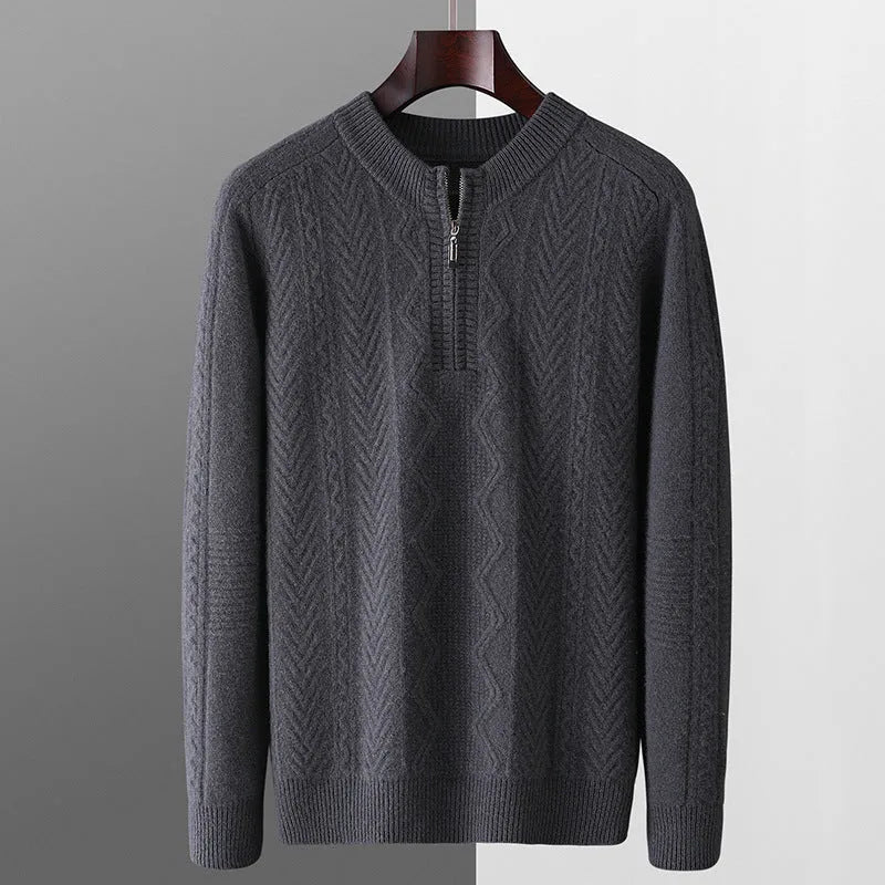 Men's grey diamond pattern wool sweater with a half zip neckline on a hanger.