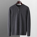 Men's grey diamond pattern wool sweater with a half zip neckline on a hanger.