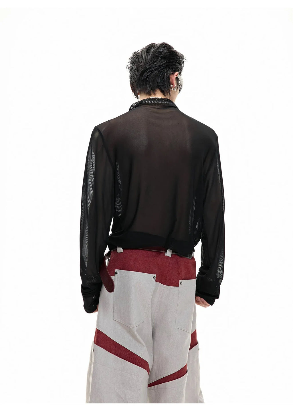 Man modelling a black slim-fit long sleeve mesh bottoming shirt with a textured ice-feel fabric.