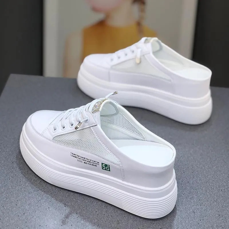 Women's white platform shoes with mesh surface detail and rounded toe