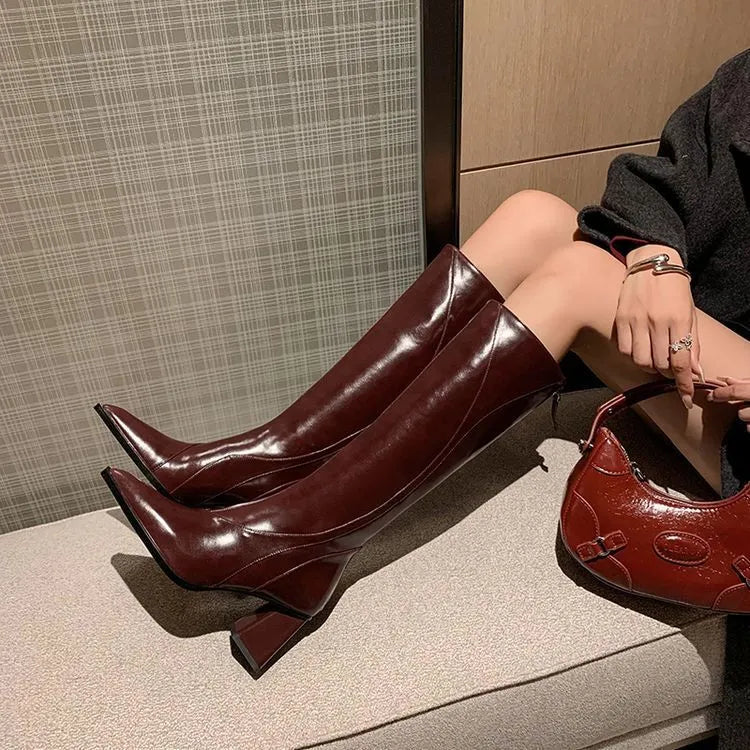 Black retro-style women's high heel riding boots made from cowhide with a waterproof platform.
