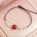 Women's natural red agate bracelet and necklace set with hand-woven construction and bean charms